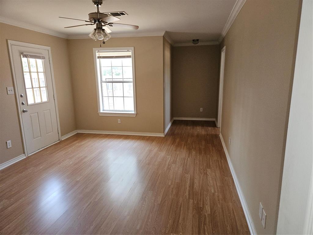 1605 Stuart Road Denton, TX 76209 - Photo 14 of 22 wooden floor in an empty room with a window
