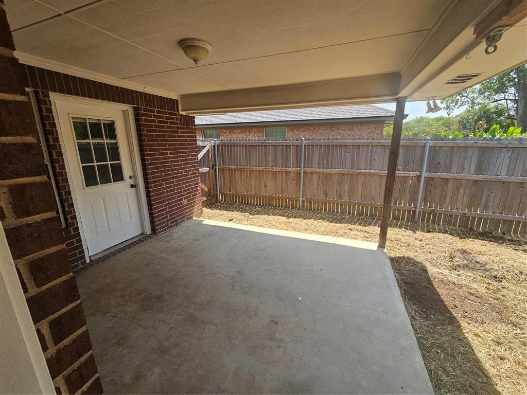 1605 Stuart Road Denton, TX 76209 - Photo 20 of 22 a view of a backyard of the house