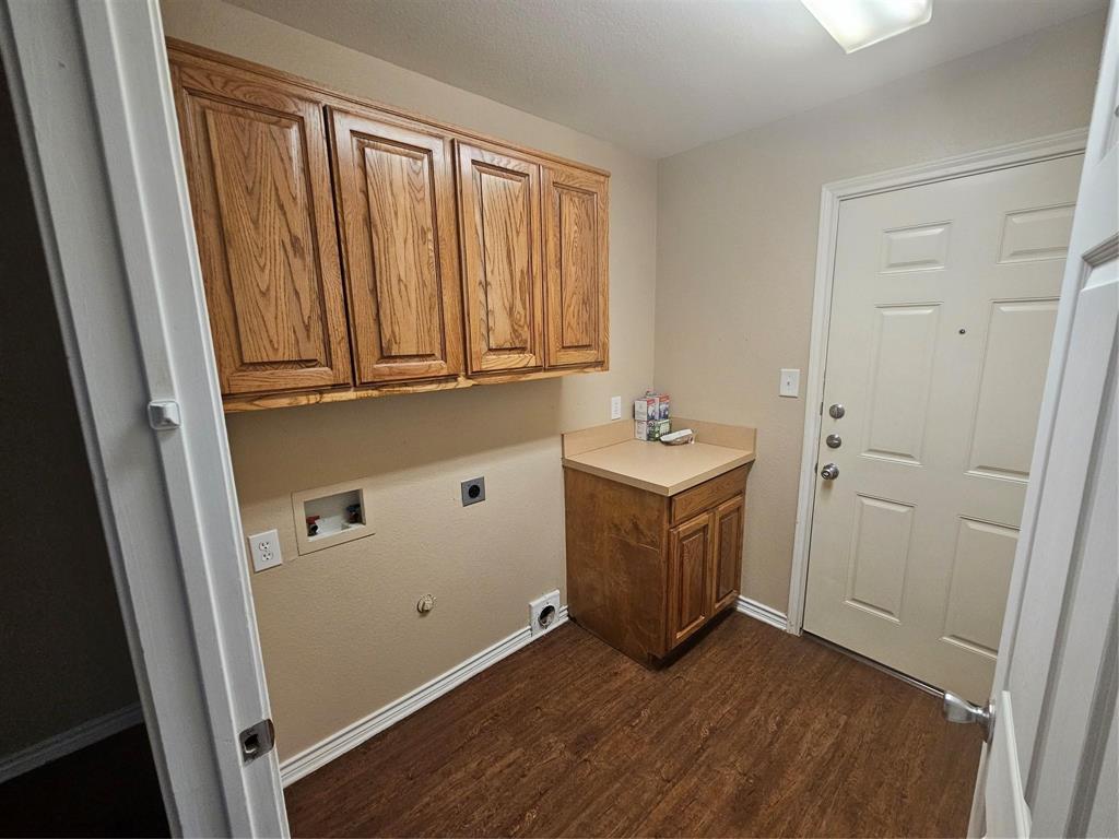 1605 Stuart Road Denton, TX 76209 - Photo 22 of 22 a room with wooden cabinets