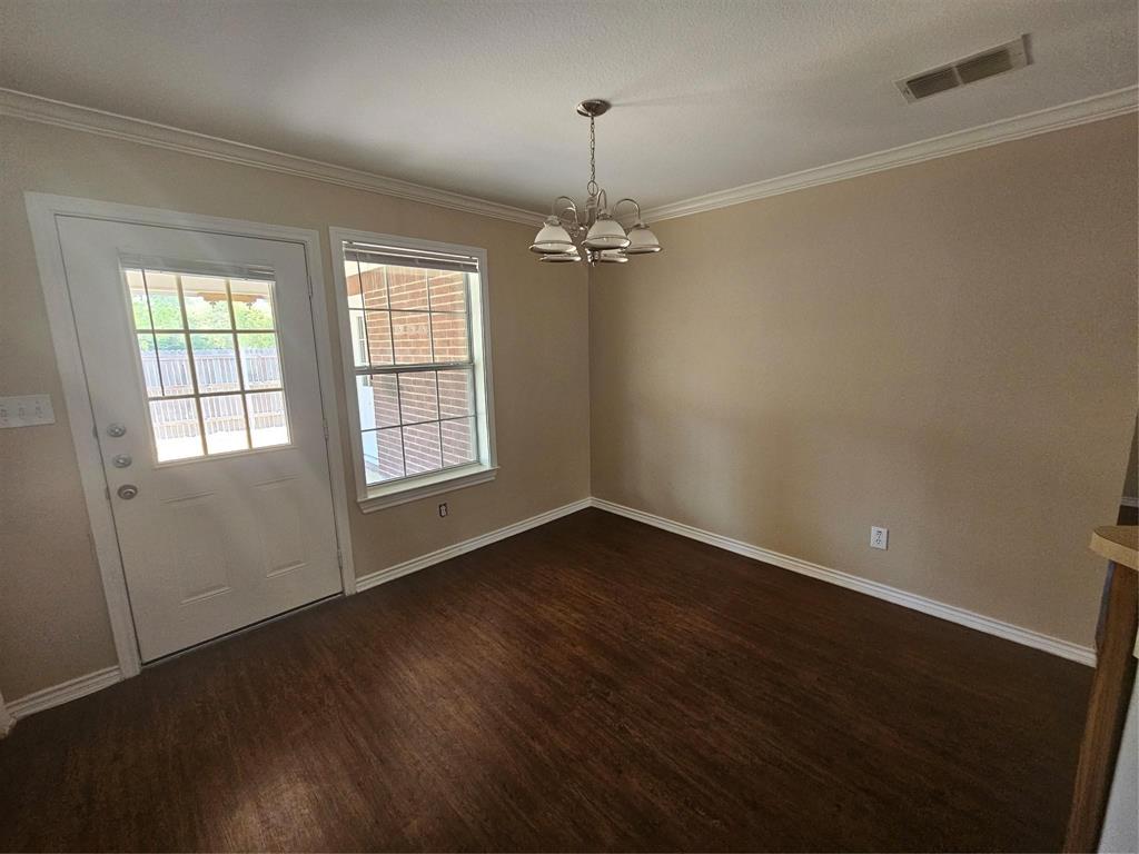 1605 Stuart Road Denton, TX 76209 - Photo 7 of 22 wooden floor in an empty room with a window