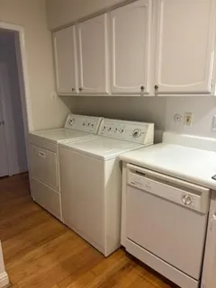 a bath tub sitting next to a white sink and vanity