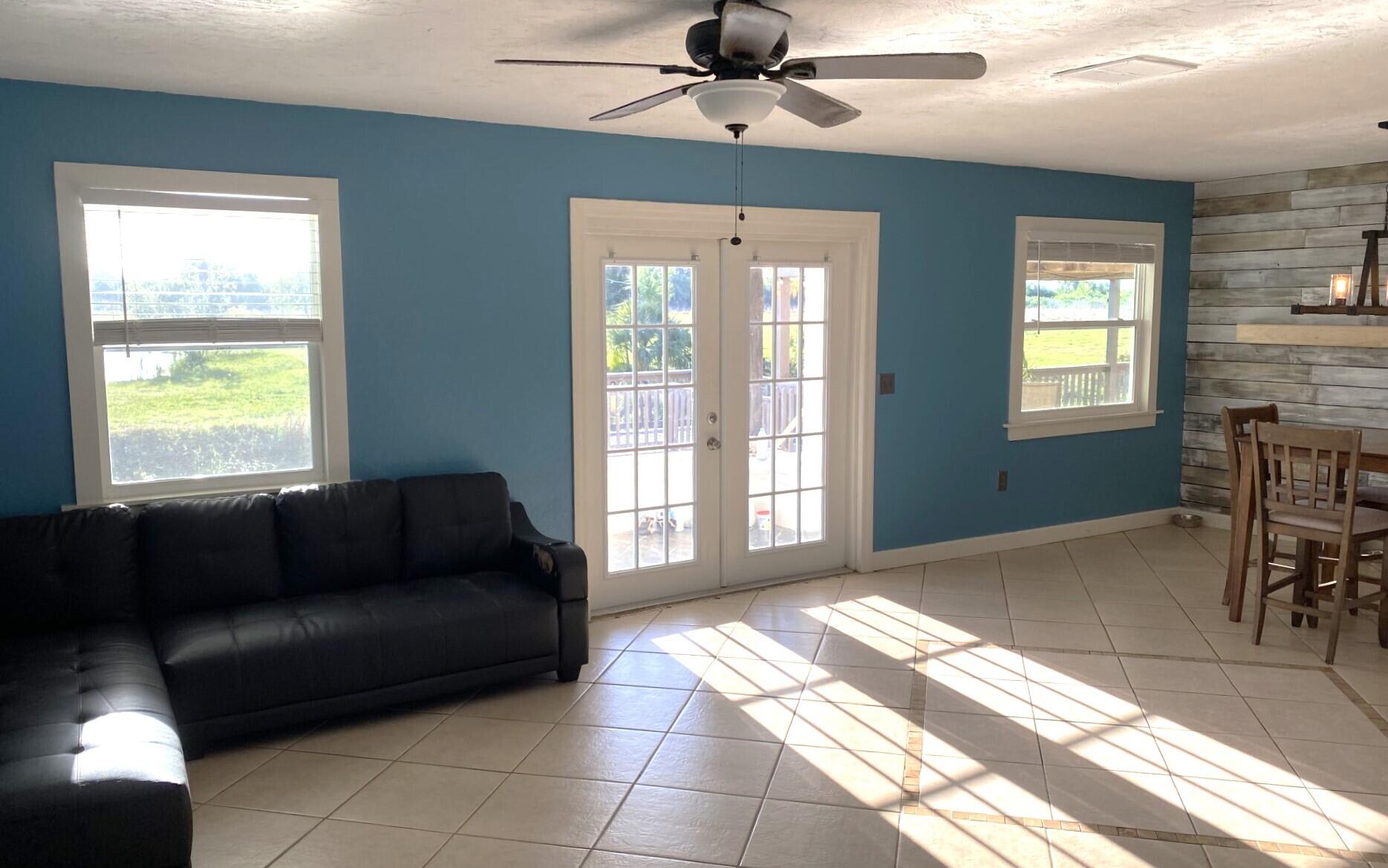 725 Mallard Road Cocoa, FL 32926 - Photo 25 of 37 a living room with furniture and a window