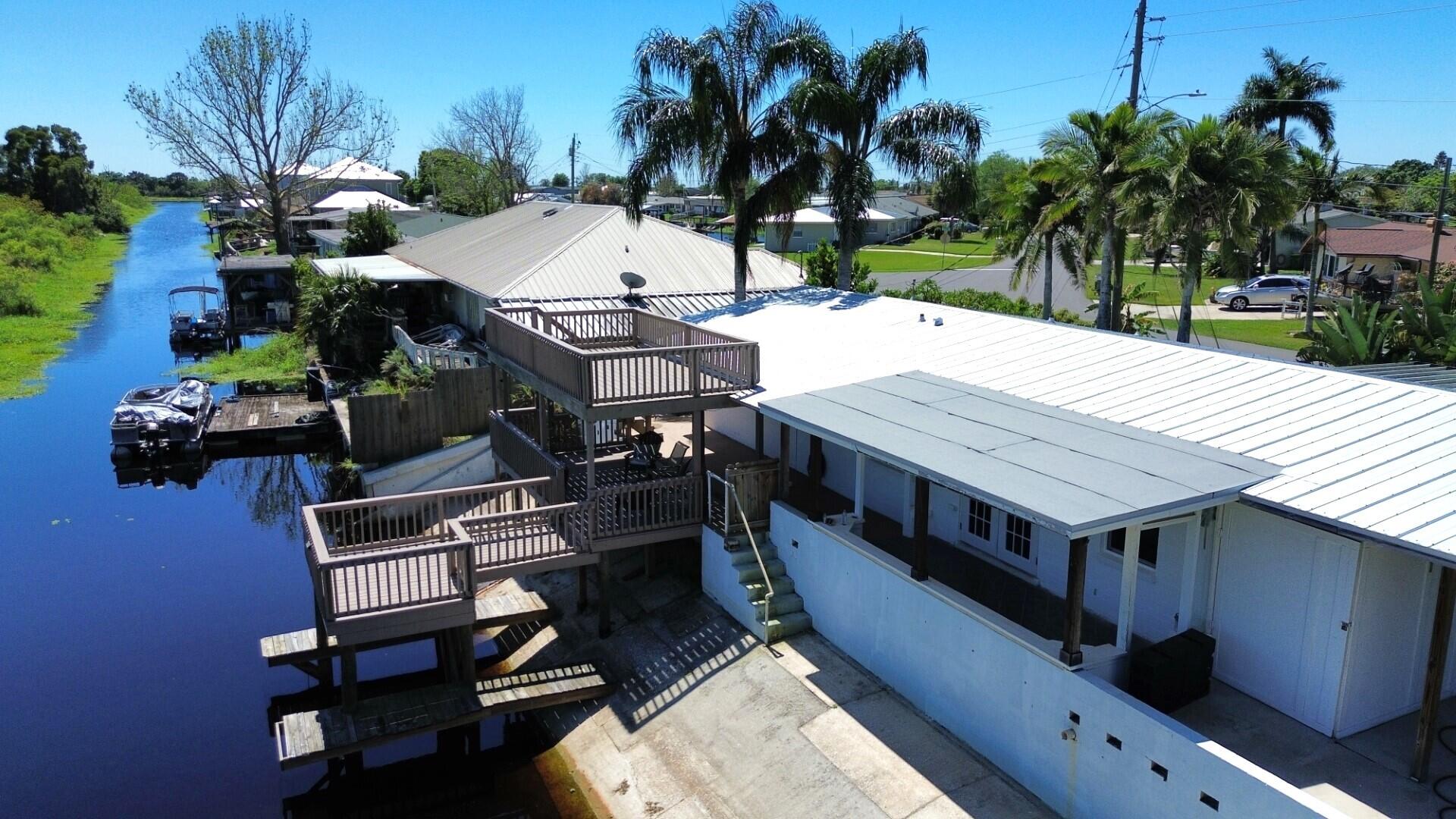 725 Mallard Road Cocoa, FL 32926 - Photo 34 of 37 an aerial view of a house with swimming pool table and chairs