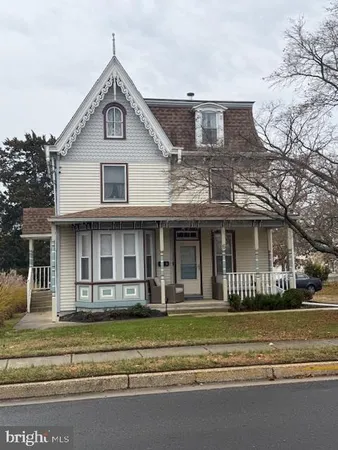 a front view of a house with a porch