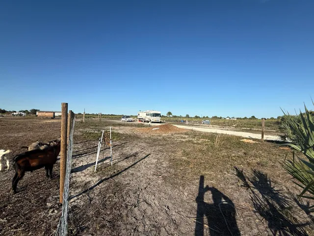 a view of a large body of water with a building in the background