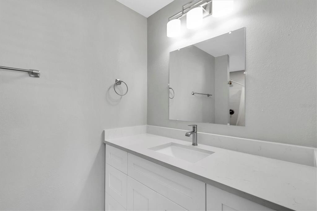 5925 Seaside Drive New Port Richey, FL 34652 - Photo 19 of 55 a bathroom with a sink and a mirror
