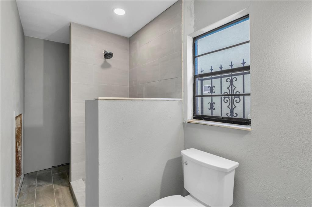 5925 Seaside Drive New Port Richey, FL 34652 - Photo 20 of 55 a white toilet sitting next to a bathroom sink