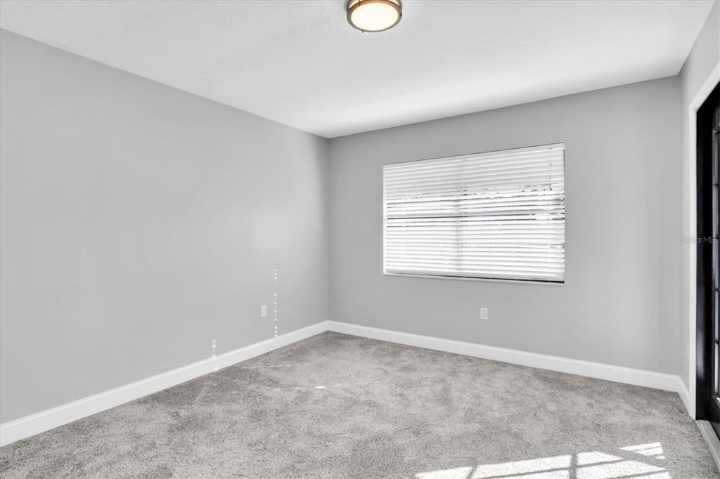 5925 Seaside Drive New Port Richey, FL 34652 - Photo 21 of 55 an empty room with windows
