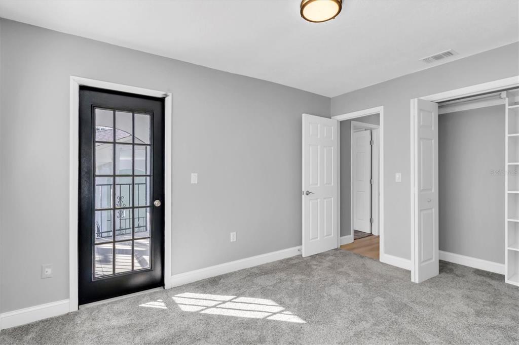 5925 Seaside Drive New Port Richey, FL 34652 - Photo 22 of 55 a view of an empty room with window and wooden floor
