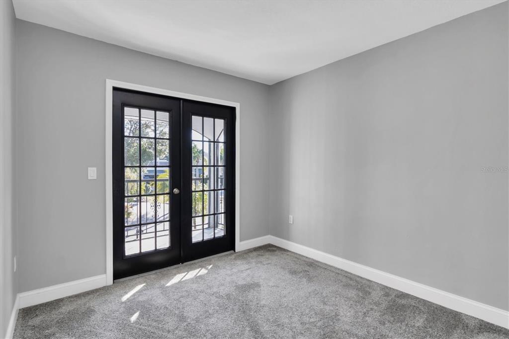 5925 Seaside Drive New Port Richey, FL 34652 - Photo 23 of 55 an empty room with windows