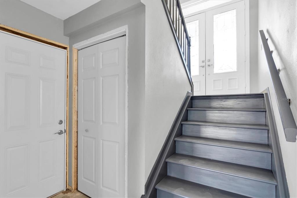 5925 Seaside Drive New Port Richey, FL 34652 - Photo 25 of 55 a view of staircase with wooden floor and stairs