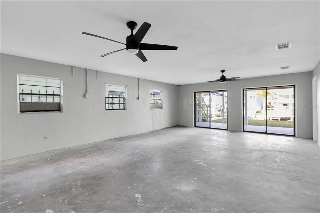 5925 Seaside Drive New Port Richey, FL 34652 - Photo 27 of 55 a view of a livingroom with a ceiling fan and window