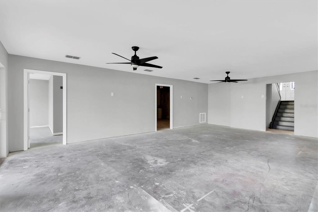 5925 Seaside Drive New Port Richey, FL 34652 - Photo 28 of 55 a view of a livingroom with a ceiling fan and window