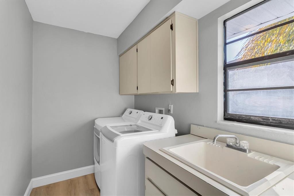 5925 Seaside Drive New Port Richey, FL 34652 - Photo 31 of 55 a bathroom with a sink and a vanity