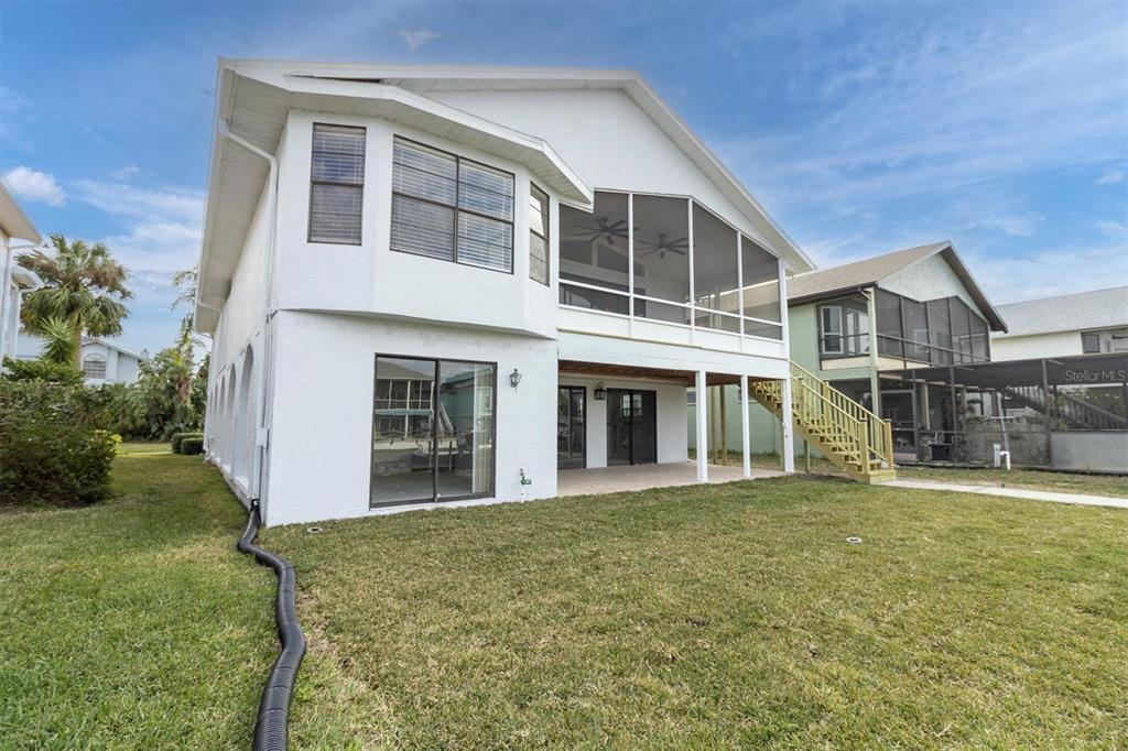 5925 Seaside Drive New Port Richey, FL 34652 - Photo 47 of 55 a front view of a house with a yard