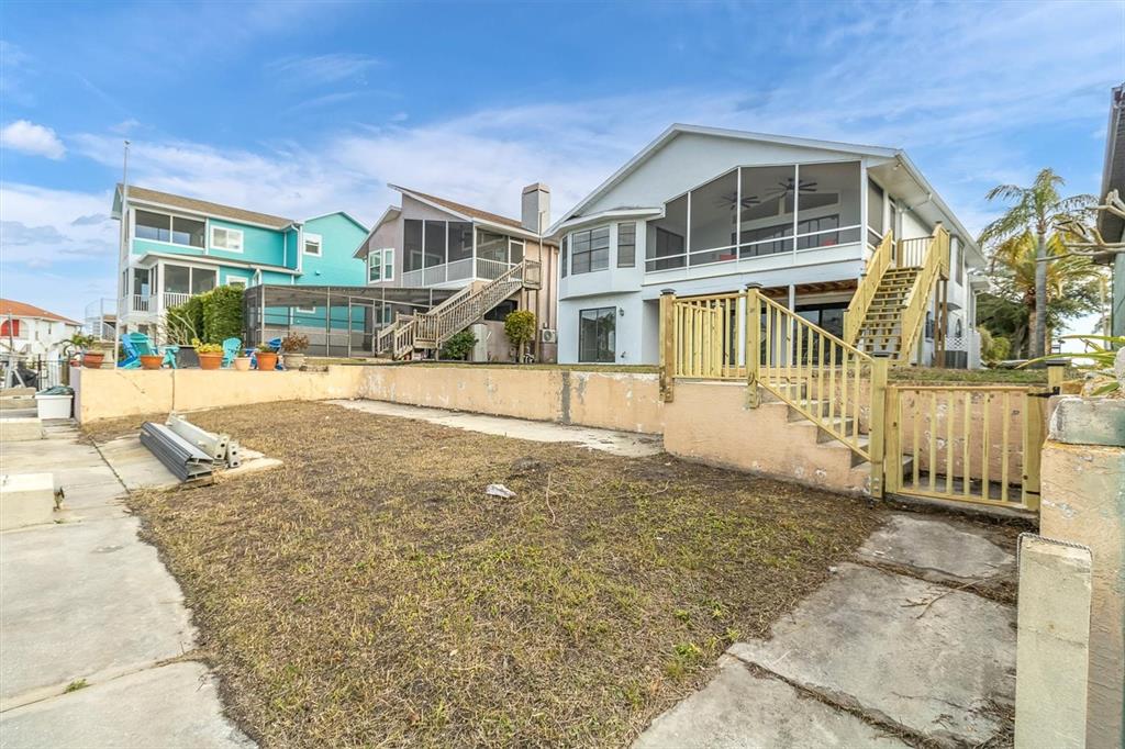 5925 Seaside Drive New Port Richey, FL 34652 - Photo 48 of 55 a front view of a house with a yard
