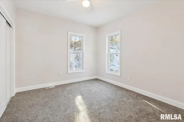 an empty room with windows