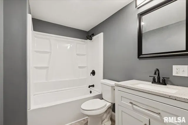 a bathroom with a sink a toilet and a bathtub