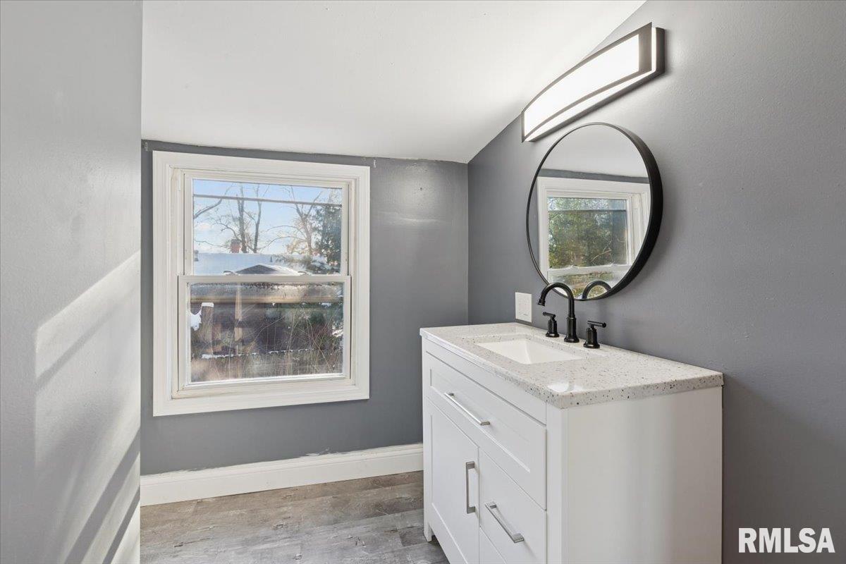 3312 Garfield Street Clinton, IA 52732 - Photo 20 of 31 a bathroom with a sink and a mirror