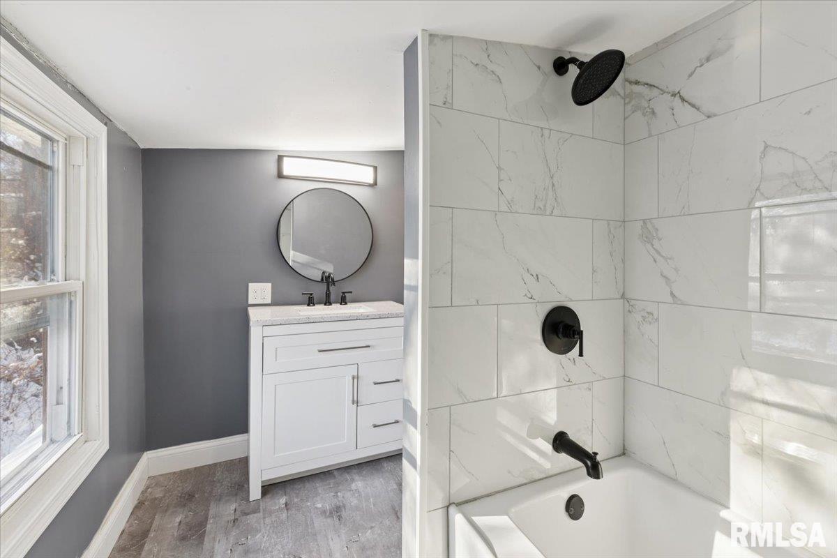 3312 Garfield Street Clinton, IA 52732 - Photo 21 of 31 a bathroom with a sink a toilet and shower