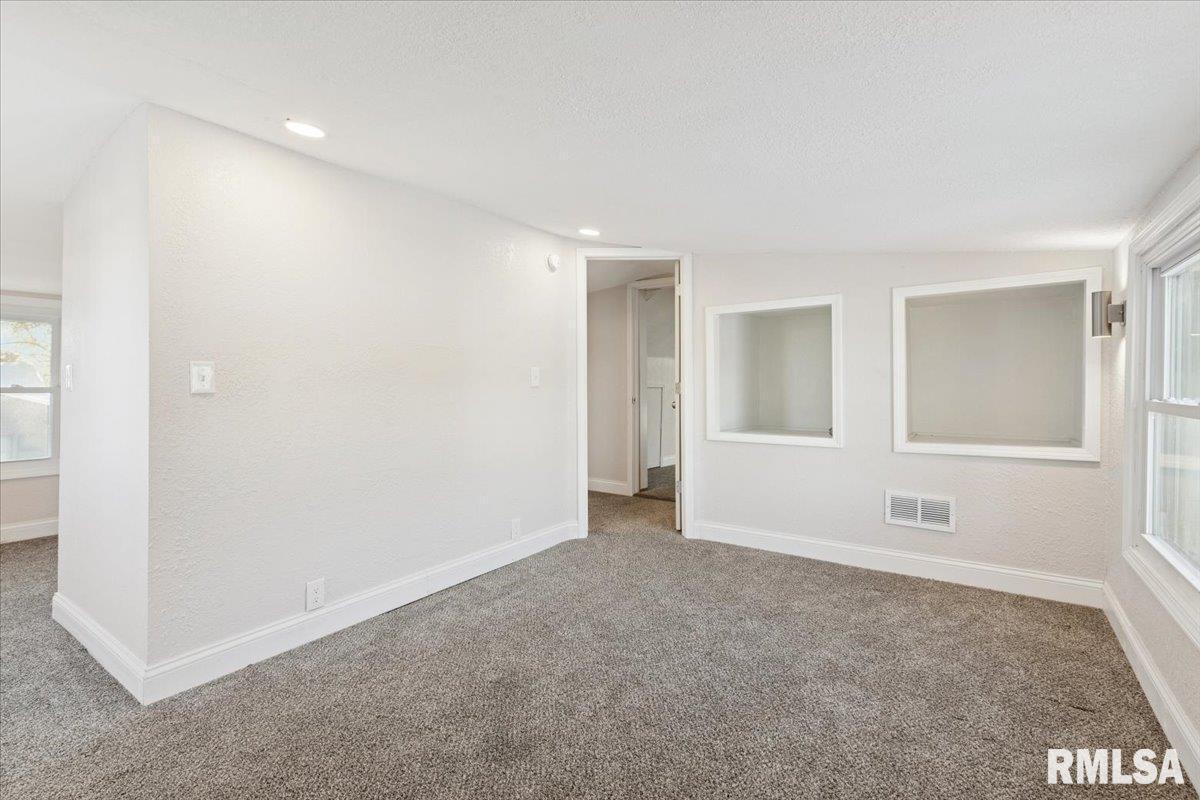 3312 Garfield Street Clinton, IA 52732 - Photo 22 of 31 a view of an empty room with a window