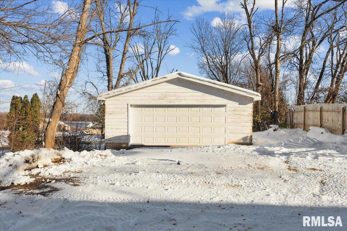 3312 Garfield Street Clinton, IA 52732 - Photo 27 of 31 a front view of a house with a yard covered in snow