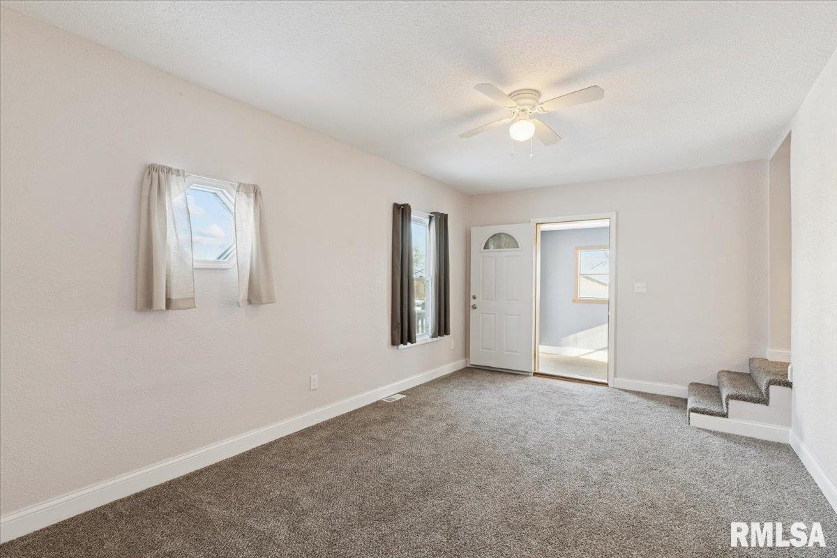 3312 Garfield Street Clinton, IA 52732 - Photo 5 of 31 a view of an empty room with a window