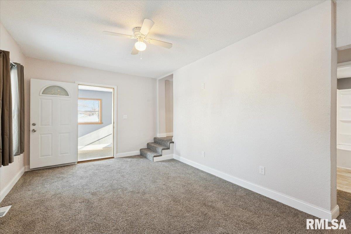 3312 Garfield Street Clinton, IA 52732 - Photo 6 of 31 an empty room with closet and a ceiling fan