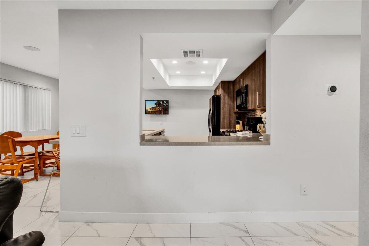 200 East Racquet Club Road, Unit 31 Palm Springs, CA 92262 - Photo 16 of 49 a view of entryway and hall