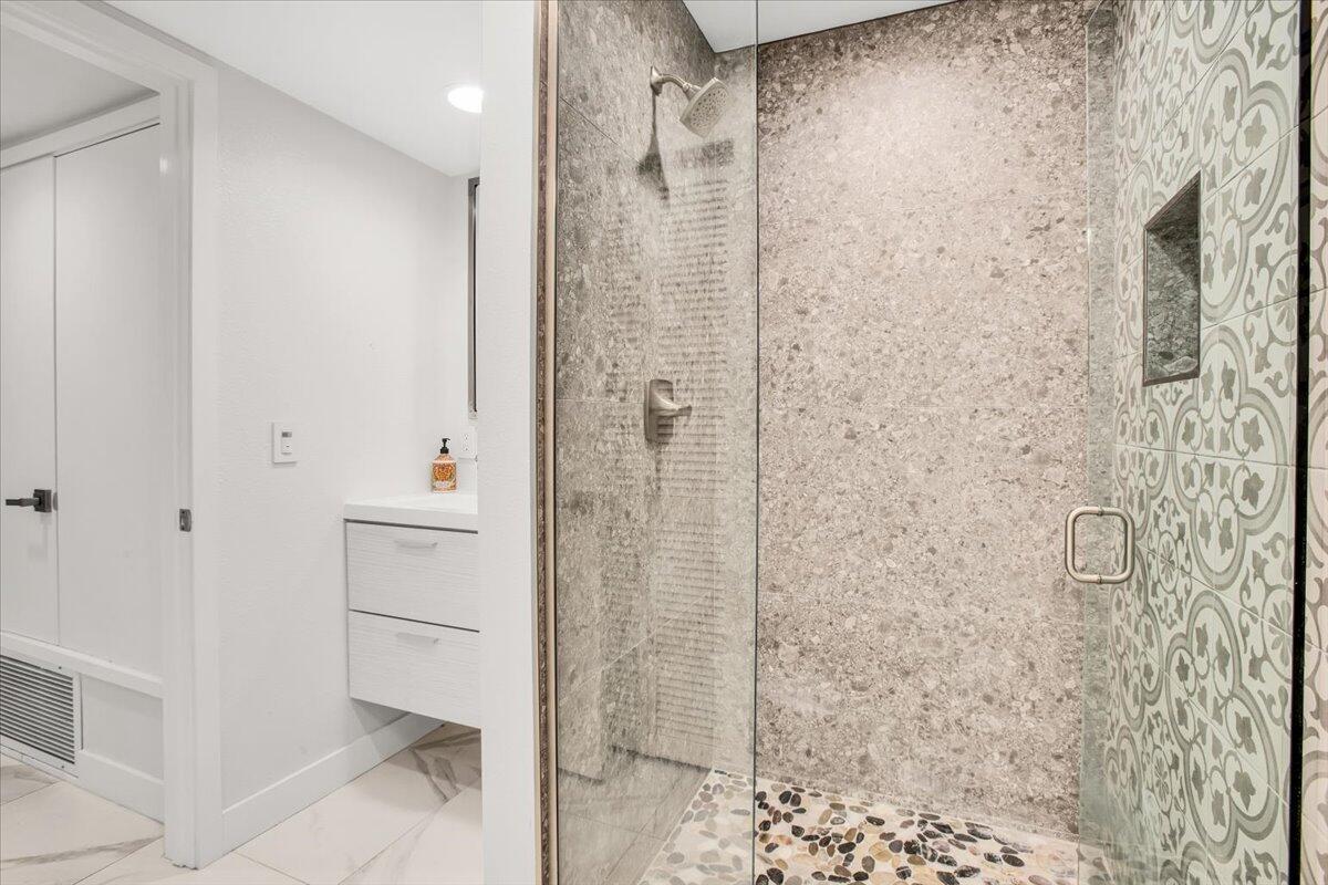 200 East Racquet Club Road, Unit 31 Palm Springs, CA 92262 - Photo 21 of 49 a bathroom with a shower and a sink