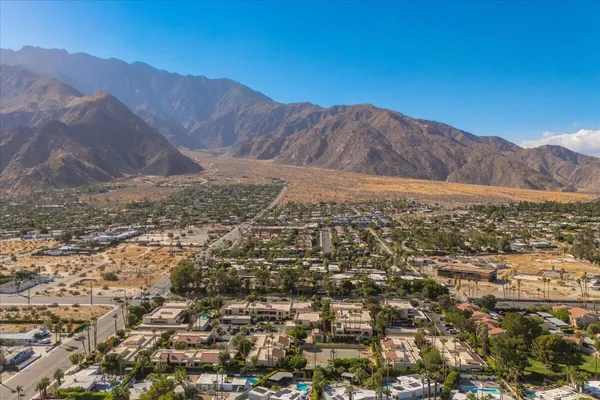 an aerial view of residential house and green space
