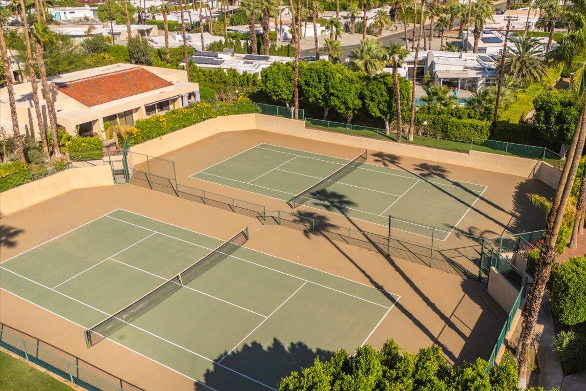 200 East Racquet Club Road, Unit 31 Palm Springs, CA 92262 - Photo 4 of 49 a view of a tennis court