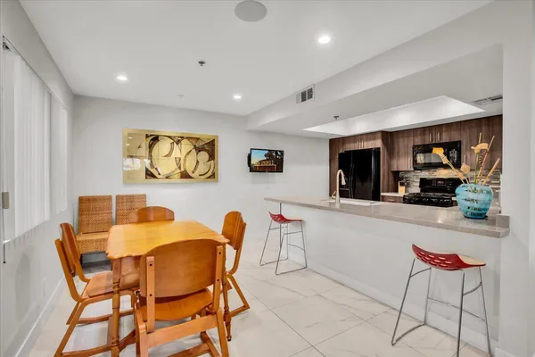 a dining room with furniture and window