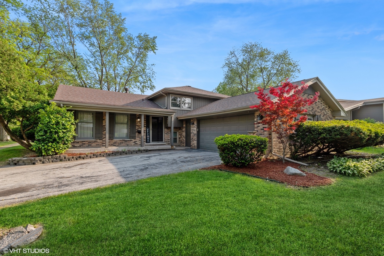 front view of a house with a yard