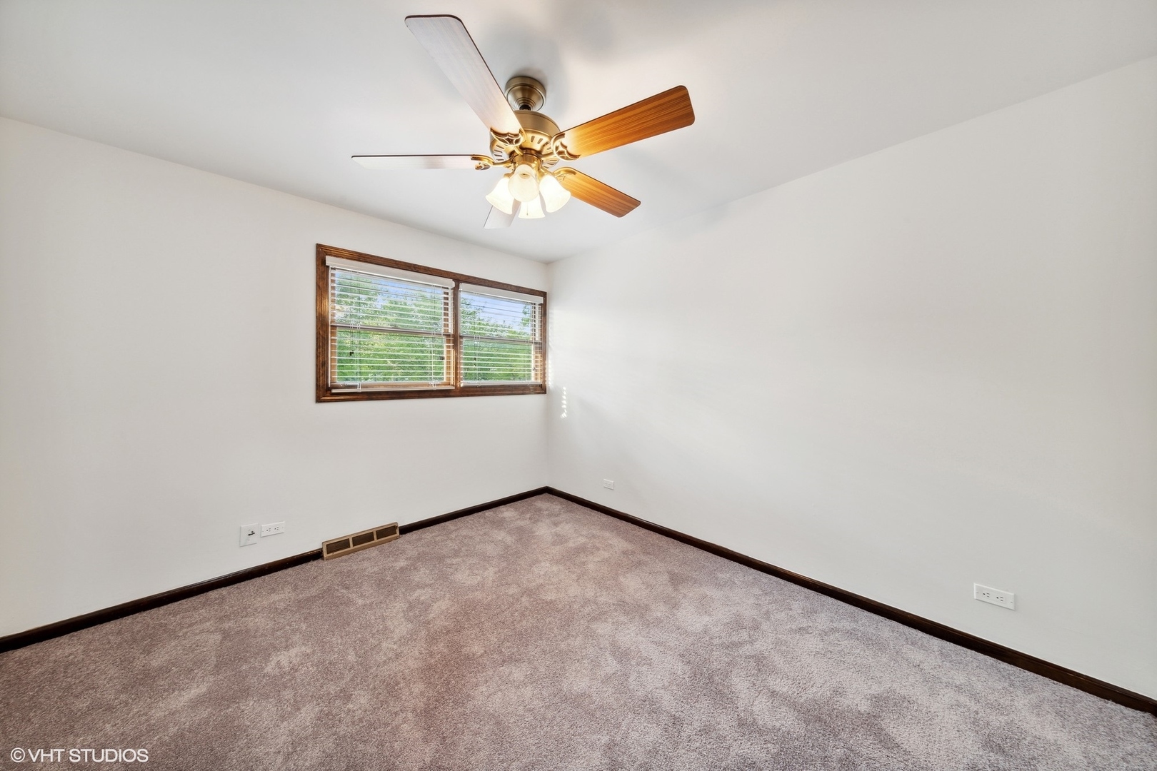 902 Maple Road Flossmoor, IL 60422 - Photo 11 of 27 an empty room with windows and fan