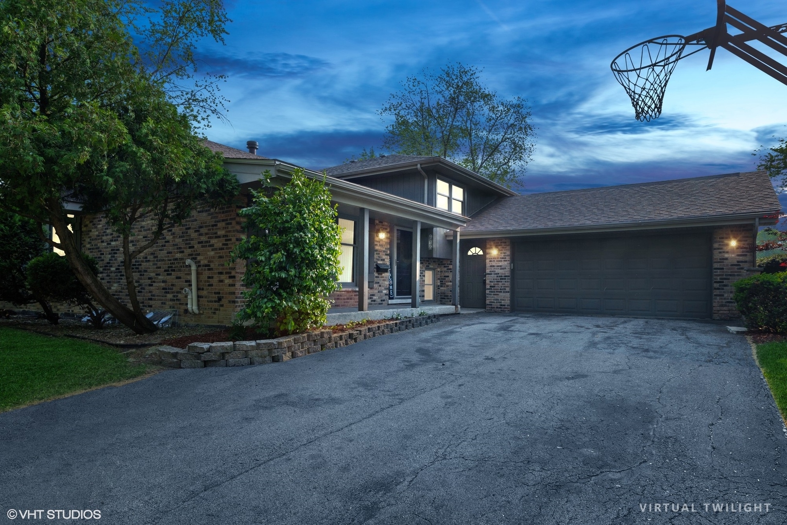 902 Maple Road Flossmoor, IL 60422 - Photo 2 of 27 a view of a house with potted plants and large trees