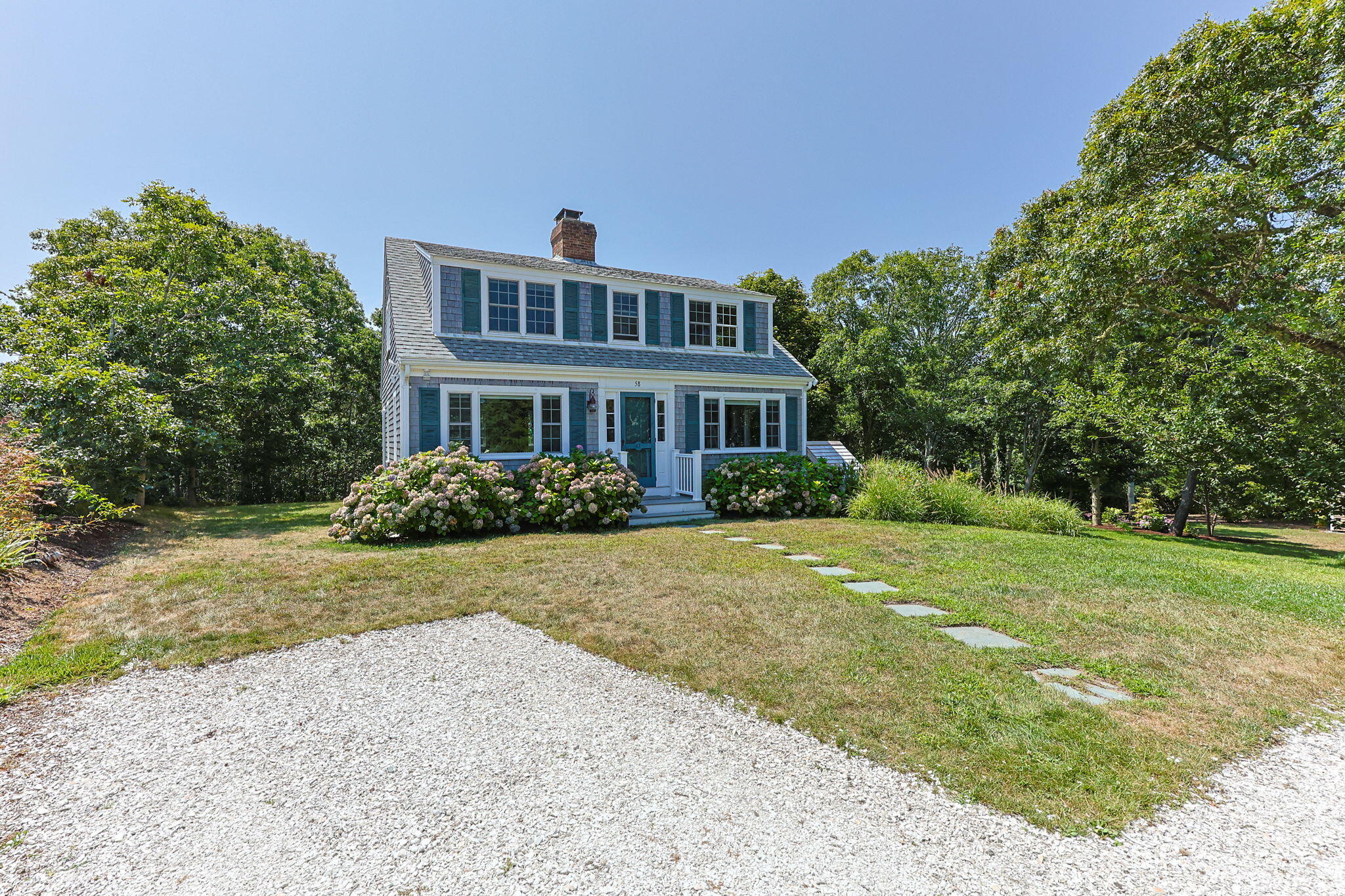 58 Stepping Stones Road Chatham, MA 02633 - Photo 3 of 52 a front view of a house with a yard and trees