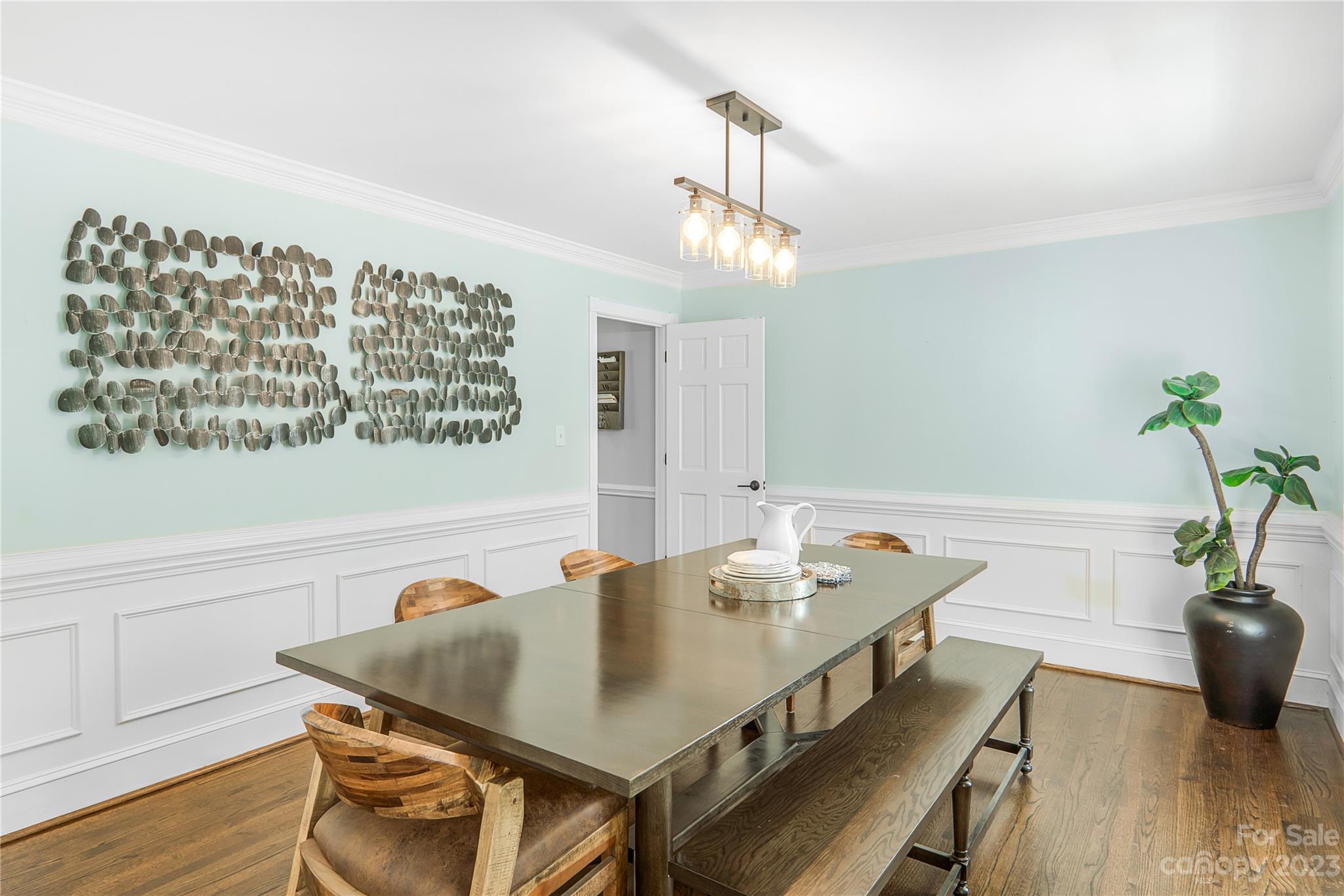 4339 Quail View Road Charlotte, NC 28226 - Photo 17 of 40 a view of a dining room with furniture and wooden floor