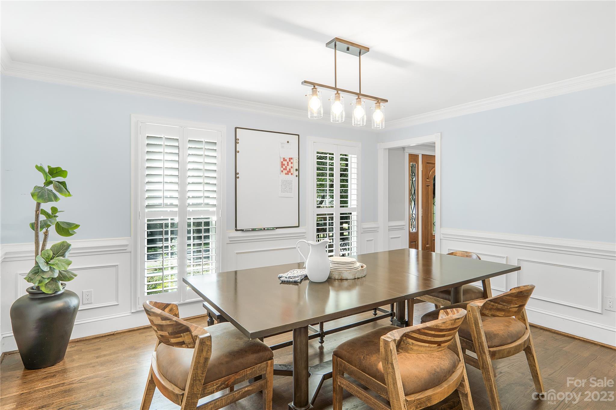 4339 Quail View Road Charlotte, NC 28226 - Photo 18 of 40 a view of a dining room with furniture window and wooden floor