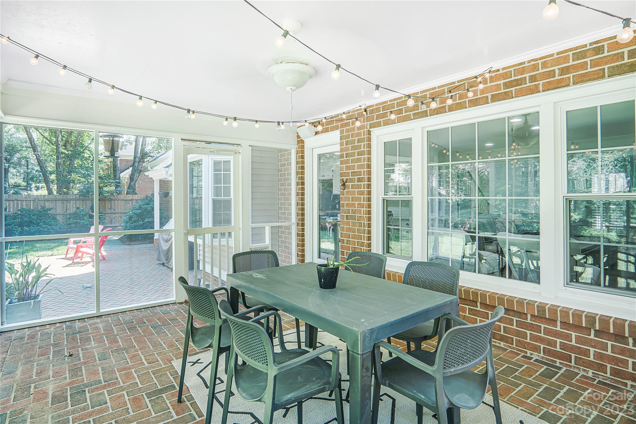 4339 Quail View Road Charlotte, NC 28226 - Photo 39 of 40 a view of a dining room with furniture large windows and wooden floor