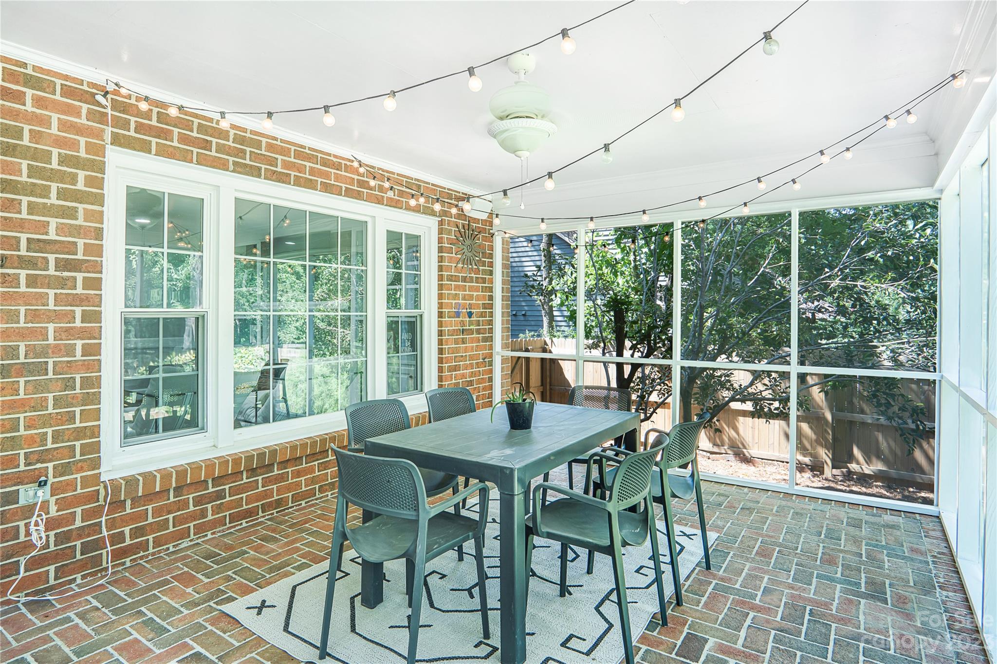 4339 Quail View Road Charlotte, NC 28226 - Photo 40 of 40 a dining room with furniture large windows and wooden floor