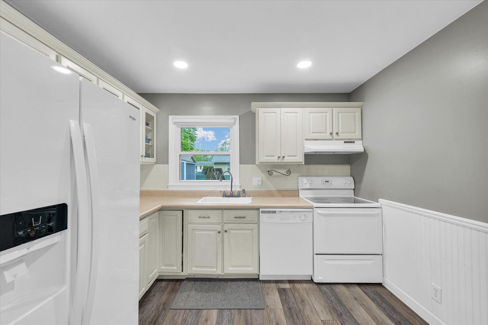 2603 Trafalgar Square Champaign, IL 61821 - Photo 11 of 32 a kitchen with a sink a refrigerator and cabinets