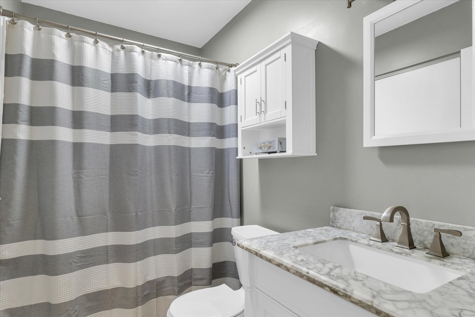 2603 Trafalgar Square Champaign, IL 61821 - Photo 20 of 32 a bathroom with a granite countertop sink and a mirror
