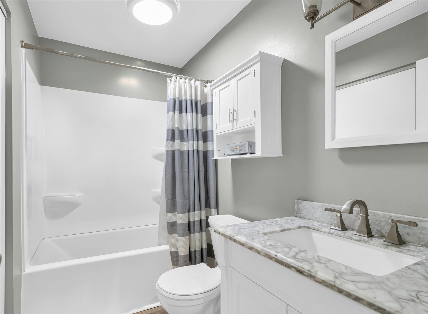 2603 Trafalgar Square Champaign, IL 61821 - Photo 21 of 32 a bathroom with a granite countertop sink toilet and shower