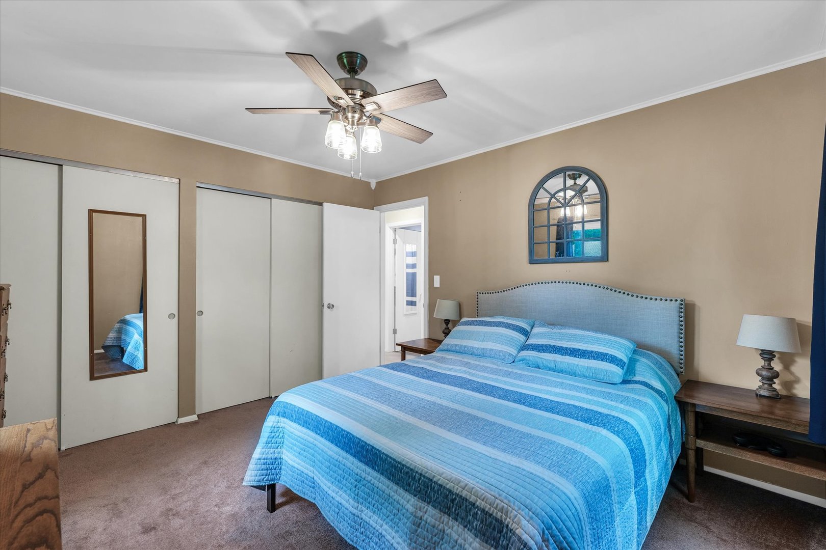 2603 Trafalgar Square Champaign, IL 61821 - Photo 23 of 32 a bedroom with a bed and a chandelier