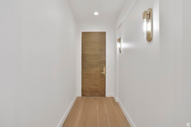 990 Manen Street Washington, UT 84780 - Photo 2 of 43 Hallway featuring wood-finish flooring, recessed lighting, and modern brass wall sconces