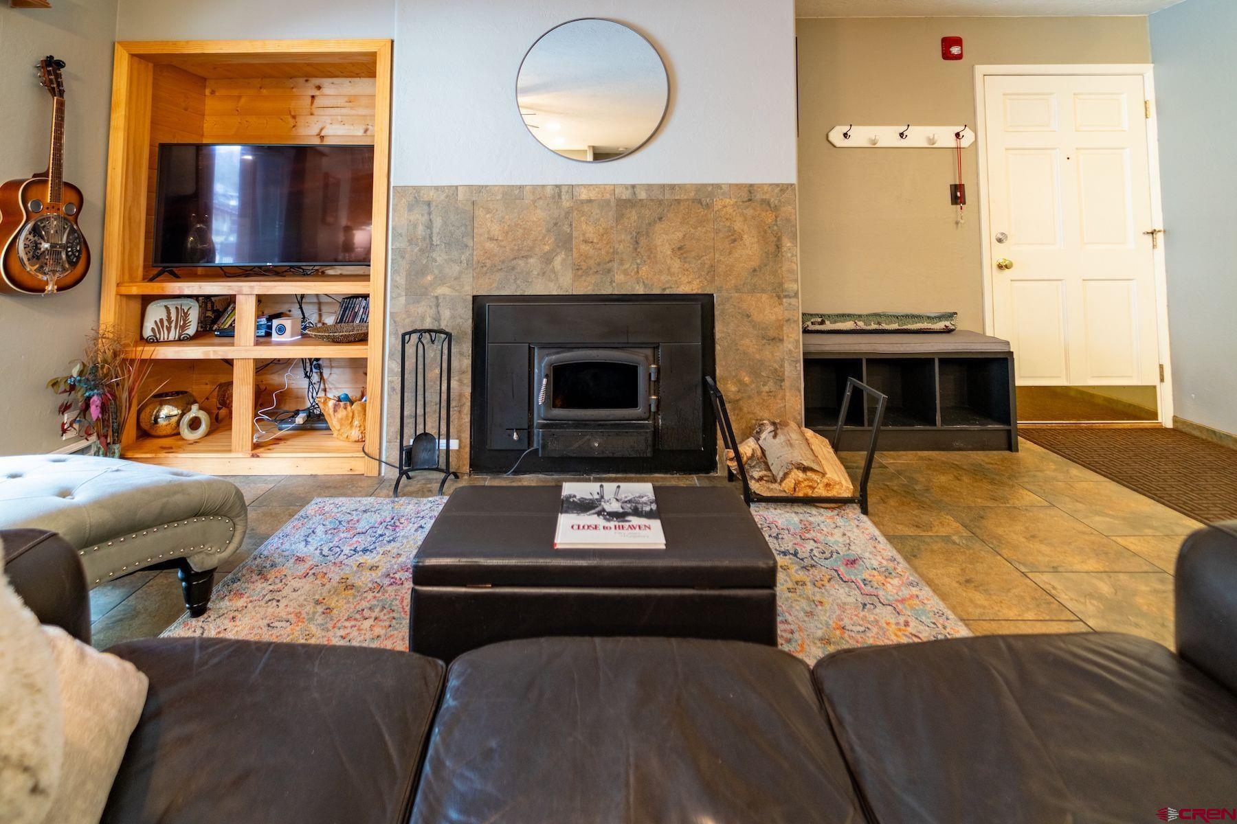 395 Sheol Street, Unit 26 Durango, CO 81301 - Photo 13 of 30 a living room with furniture and a fireplace