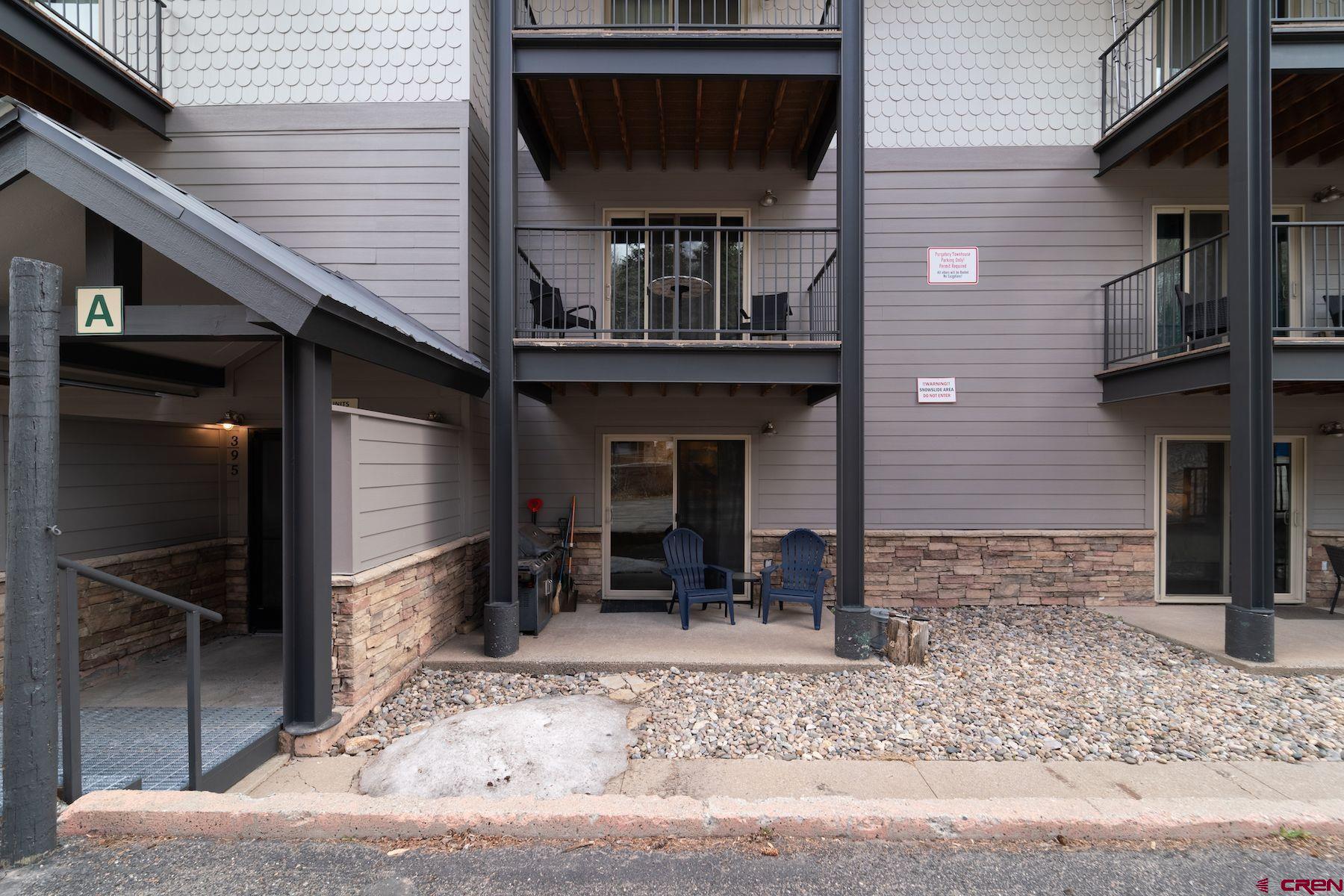 395 Sheol Street, Unit 26 Durango, CO 81301 - Photo 20 of 30 a front view of a house with barbeque grill and seating space