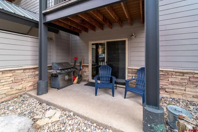 a view of a two chairs in the balcony