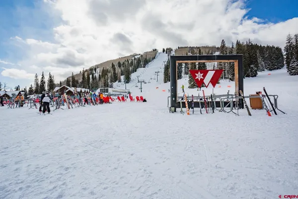 a group of people sitting in a parking area